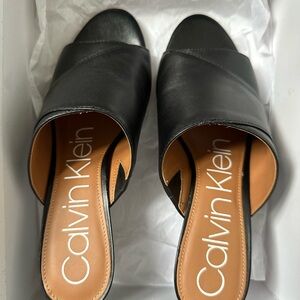 Calvin Klein Black Mules Sleek and Stylish